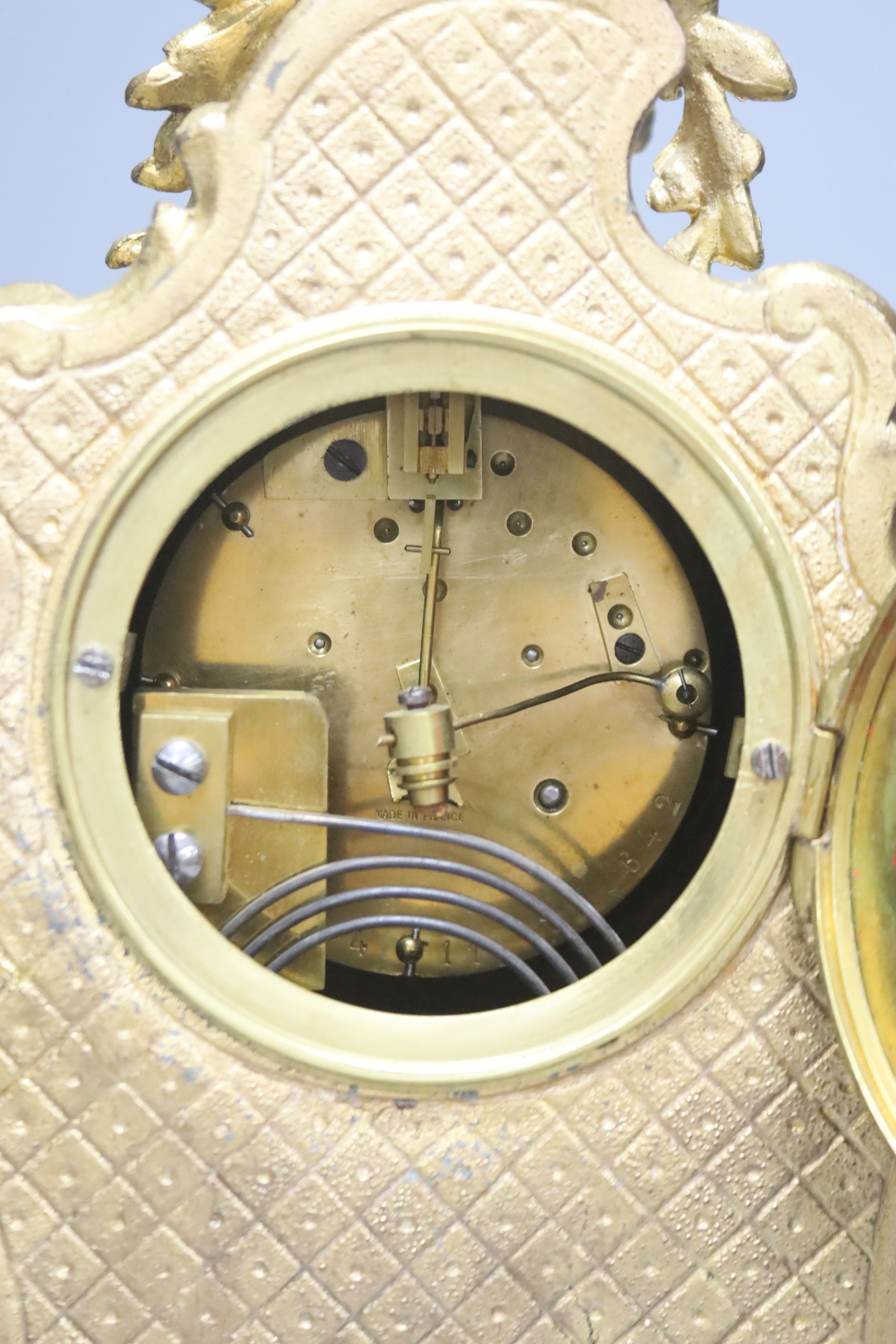 An early 20th century French gilt metal and porcelain eight day mantel clock, height 37cm